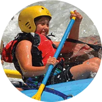 Young girl rafting the Tuolumne River near Yosemite.