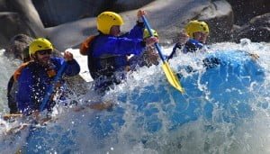 Paddling throug huge waves on Cherry Creek